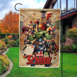 May include: A rectangular garden flag featuring a collage of Marvel superheroes in a classroom setting. The flag has the words "BACK TO SCHOOL" in red and white. The background is a classroom with a chalkboard and books.