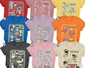 May include: A collection of colorful t-shirts featuring cartoon animal characters. Each shirt has a unique design with text, including "Gerald," "Piggies," "Pigeon," "The Duckling," "The Bus Driver," "Cat the Cat," "Knuffle Bunny," "Hippo," and "Squirrel."