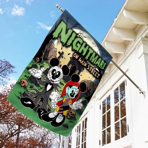 May include: A rectangular flag featuring a Halloween-themed design with the text "NIGHTMARE ON MAIN STREET". The flag depicts cartoon characters in a spooky graveyard setting, with a full moon in the background.
