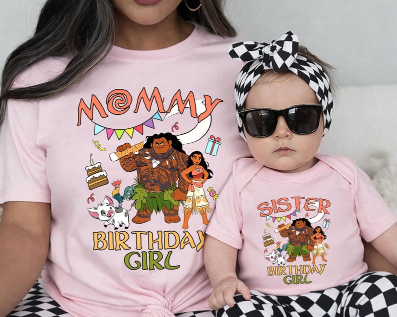 May include: A light pink t-shirt and a matching baby bodysuit, both featuring a graphic print of Moana characters, a cake, and the text MOMMY BIRTHDAY GIRL and SISTER BIRTHDAY GIRL. The baby wears a black and white checkered headband and sunglasses.
