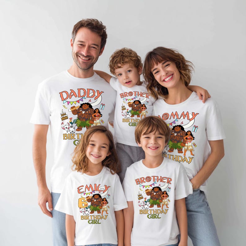 May include: A set of white short-sleeved t-shirts featuring a colorful graphic print of characters from the movie Moana. The shirts include text such as DADDY, MOMMY, BROTHER, and EMILY, along with the phrase BIRTHDAY GIRL and birthday icons.