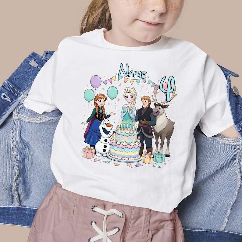 May include: White t-shirt featuring a colorful graphic of characters from the movie Frozen, a birthday cake, balloons, and the number 4. The word "Name" is above the characters.