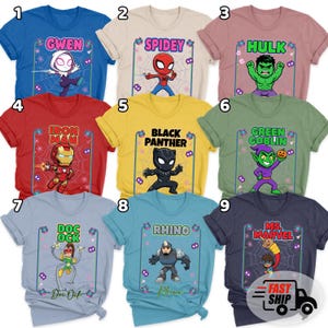 May include: A selection of vibrant graphic t-shirts showcasing superhero characters such as Gwen, Spidey, Hulk, Iron Man, Black Panther, Green Goblin, Doc Ock, Rhino, and Ms. Marvel. Each tee has a distinct design.