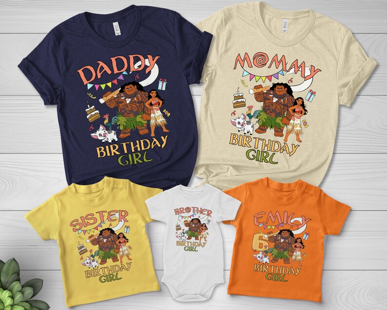 May include: A collection of five t-shirts and one baby bodysuit in navy, cream, yellow, white, and orange. Each garment features a graphic print of characters from Moana, including Maui, Moana, and Pua, with birthday-themed text and illustrations.