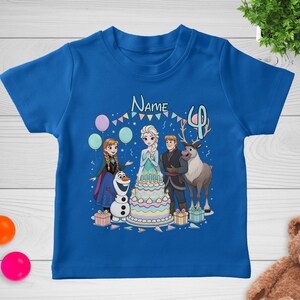 May include: A royal blue t-shirt featuring a colorful graphic of characters from the movie Frozen, a birthday cake, and the number 4. The word "Name" is above the characters. Balloons and presents are also included in the design.