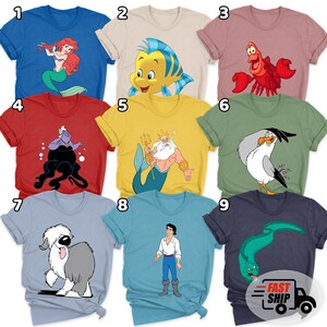 May include: A collection of nine short-sleeved t-shirts in various colours, each featuring a different character from The Little Mermaid. The shirts display Ariel, Flounder, Sebastian, Ursula, King Triton, Scuttle, Max the dog, Prince Eric, and Flotsam.