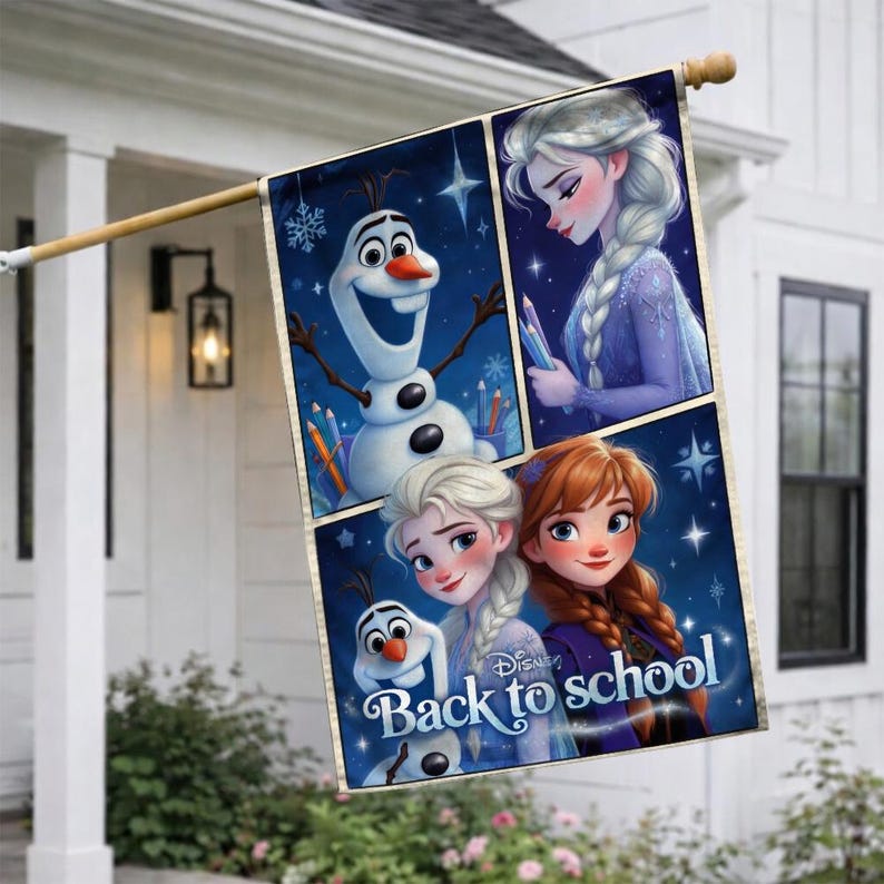 May include: A rectangular outdoor flag featuring characters from the movie Frozen. The flag has a dark blue background with images of Elsa, Anna, and Olaf. The words "Back to school" are printed on the flag.
