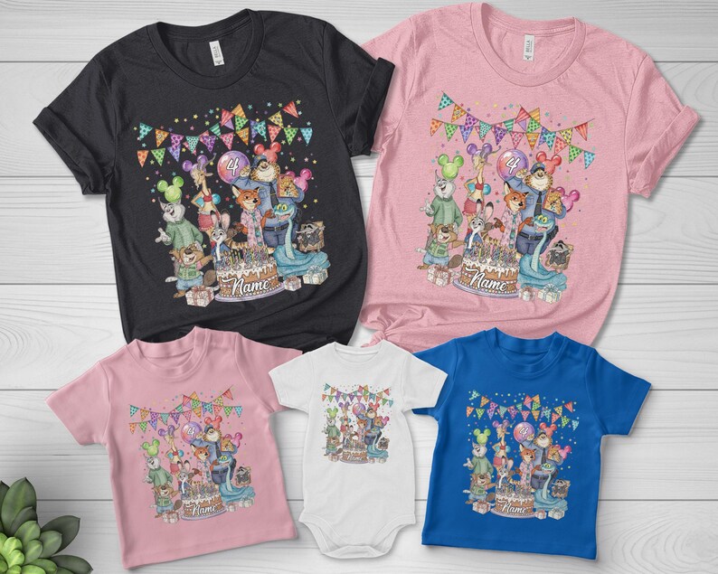 May include: A collection of t-shirts and a onesie in various colors, including black, pink, white, and blue. Each garment features a colorful cartoon design with a birthday theme, including a cake and animal characters. The text "Name" is visible.