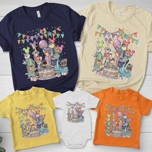 May include: A collection of colorful t-shirts and a onesie featuring a birthday party design with cartoon characters, a cake, and the word "Name". The shirts are navy, yellow, orange, and beige.