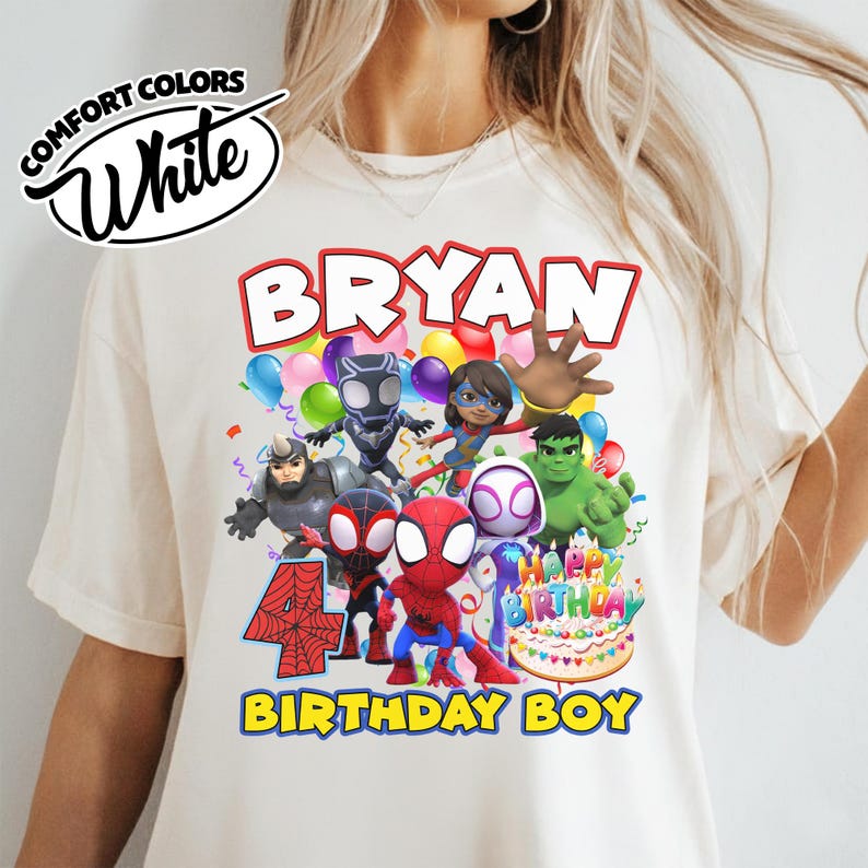 May include: A cream-colored t-shirt featuring a graphic print of various superhero characters, a large red number 4, a birthday cake, and the text BRYAN HAPPY BIRTHDAY BIRTHDAY BOY. The top left corner displays a logo with the text COMFORT COLORS White.