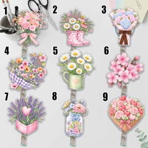 May include: A collection of floral-themed badge reels. Designs include bouquets, daisies in a rain boot, flowers in a watering can, an umbrella with flowers, cherry blossoms, lavender, flowers in a mason jar, and a heart-shaped basket of flowers.
