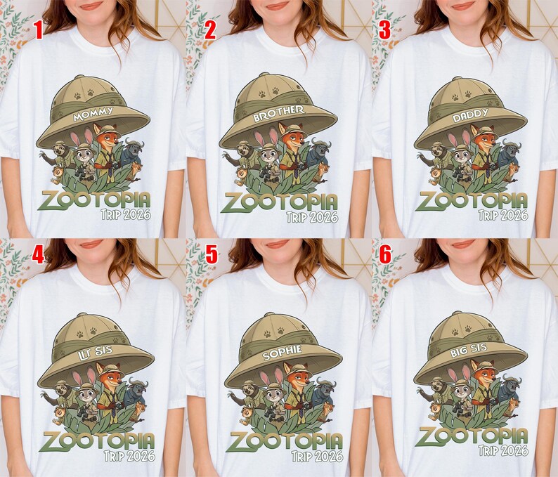 May include: White t-shirts with a Zootopia graphic. Each shirt has a different word on the safari hat: "Mommy", "Brother", "Daddy", "Lil Sis", "Sophie", and "Big Sis". The text "Zootopia Trip 2026" is below the graphic. The shirts are for a family trip.