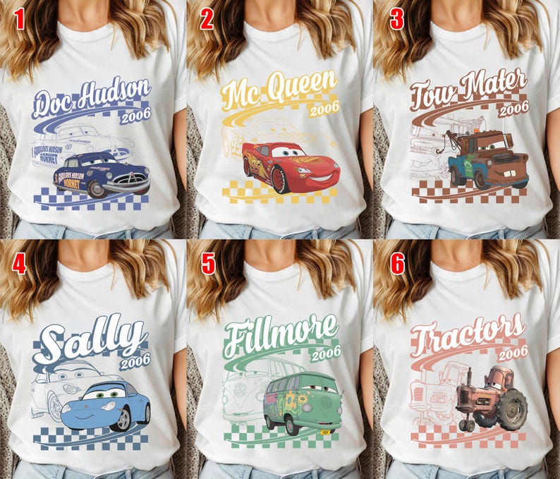 May include: A collection of six white t-shirts featuring Disney Pixar Cars characters. Each shirt displays a character name, the year 2006, a checkered pattern, and a graphic of Doc Hudson, Lightning McQueen, Tow Mater, Sally, Fillmore, or Tractors.