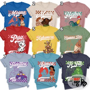 May include: A collection of nine colorful t-shirts featuring characters and text from a popular animated movie. Each shirt has a different design, including characters like Moana, Maui, Heihei, Pua, and Tamatoa. The shirts are available in various colors.