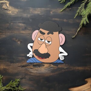 May include: A cartoon character with a brown face, black mustache, and a black hat. The character has pink ears, white hands, and is wearing a blue shirt. The character is leaning with its hands on its hips.