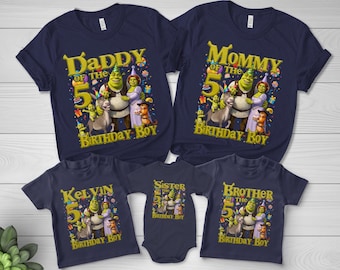 May include: A set of five navy blue t-shirts and one bodysuit featuring a Shrek-themed graphic with characters including Shrek, Fiona, Donkey, and Puss in Boots. The text includes Daddy, Mommy, Kelvin, Sister, and Brother of the 5th Birthday Boy.