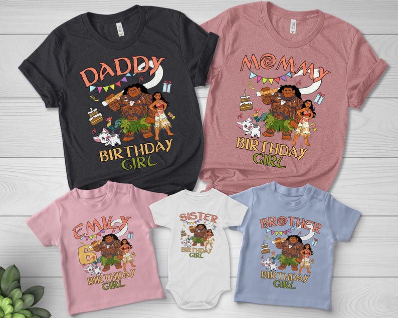May include: A collection of five shirts and a bodysuit in black, mauve, light pink, white, and light blue. Each garment features a graphic print of Maui, Moana, and Pua with birthday elements and text including DADDY, MOMMY, EMILY, SISTER, and BROTHER.