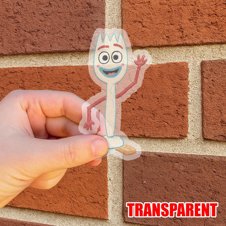 May include: Transparent sticker featuring a cartoon character with a fork-shaped head, blue eyes, and a smiling mouth. The character has red arms and is waving. The word "TRANSPARENT" is printed in red at the bottom.