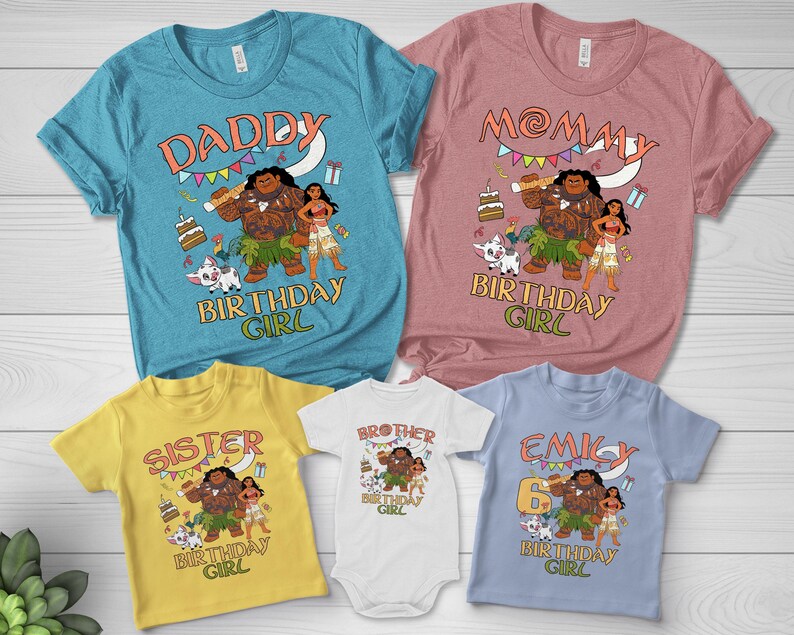 May include: A collection of five t-shirts and one bodysuit in teal, mauve, yellow, white, and light blue. Each garment features a graphic print of Moana characters, a birthday cake, and text including DADDY, MOMMY, SISTER, BROTHER, EMILY, and BIRTHDAY GIRL.