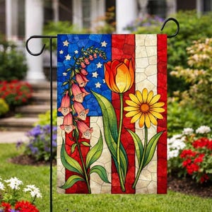 May include: A garden flag featuring a stained-glass design of the American flag with flowers. The flag has a blue field with white stars, red and white stripes, and images of a foxglove, tulip, and daisy.