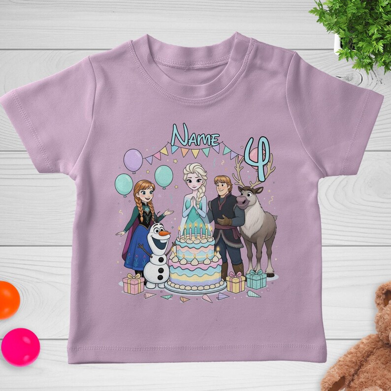 May include: A light purple t-shirt featuring a colorful graphic of characters from the movie Frozen. The design includes a birthday cake, balloons, and the number 4. The word "Name" is also visible.