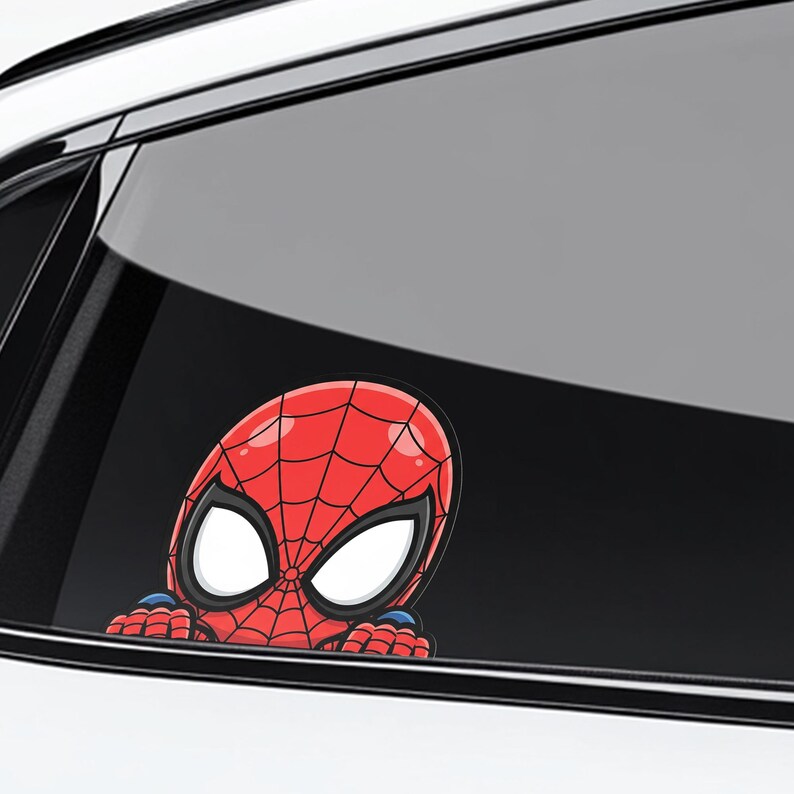 May include: A red and black Spider-Man sticker, featuring the character's iconic mask and costume design. The sticker is a cartoon-style illustration, with large white eyes and a web pattern on the mask. The sticker is designed to be placed on a car window.