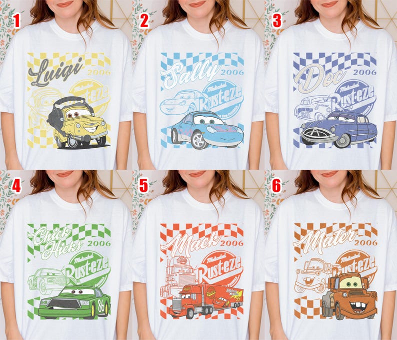 May include: White t-shirts featuring cartoon car characters. Each shirt has a different character design with text including names like "Luigi", "Sally", "Doc", "Chick Hicks", "Mack", and "Mater", along with the year "2006" and the word "Rusteze".