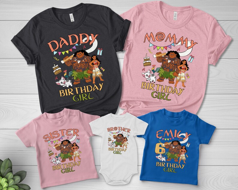 May include: A collection of five shirts and a bodysuit featuring Moana-themed birthday graphics. The garments include a black shirt, a pink shirt, a light pink shirt, a white bodysuit, and a blue shirt, all displaying characters and birthday text.