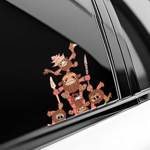 May include: A sticker featuring a group of cartoonish tribal figures with coconut-like heads, pink limbs, and holding spears and knives. The figures have exaggerated facial expressions and are arranged in a playful, stacked composition.