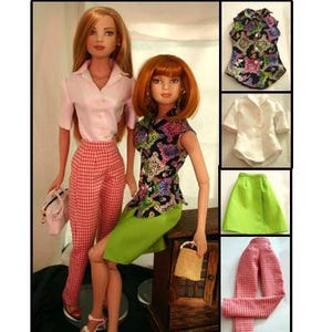 May include: Two dolls wearing clothing patterns. One doll wears a pink button-up shirt and red and white checkered pants. The other doll wears a floral print top and a green skirt. The image includes a wrap-around skirt, button-up shirt, and slacks.