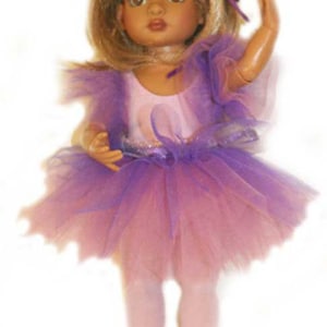 May include: A doll wearing a pink and purple tutu with a white leotard and pink tights. The doll has blonde hair and brown eyes.
