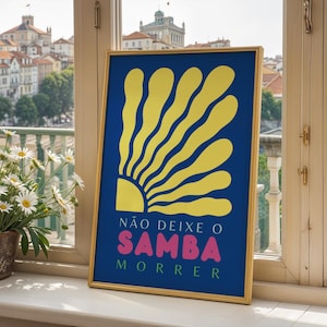 May include: A framed poster with a blue background and a yellow sunburst design. The text on the poster reads "NÃO DEIXE O SAMBA MORRER".