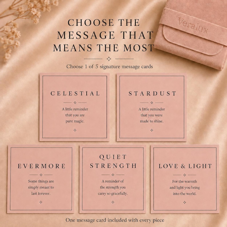 May include: Five square dusty pink message cards with black text, each featuring a unique title and sentiment: Celestial, Stardust, Evermore, Quiet Strength, and Love & Light. The cards are displayed alongside a matching pink suede jewelry pouch.