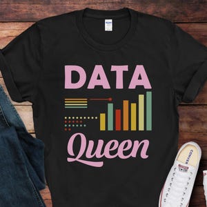 May include: Black t-shirt with a pink graphic that says "DATA QUEEN" with a bar graph and dots in retro colors.
