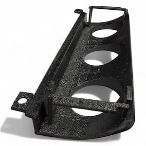 May include: A black, textured, 3D-printed object with three circular openings and a rectangular shape. The object has a curved base and several raised edges and supports. The overall design suggests a structural or functional component.