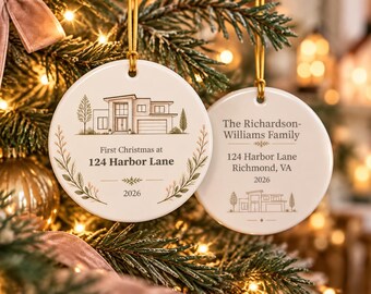 May include: Two round white ceramic ornaments with gold hanging strings. One features a house illustration, 'First Christmas at 124 Harbor Lane', and '2026'. The other displays 'The Richardson-Williams Family', '124 Harbor Lane', 'Richmond, VA', '2026', and a house.
