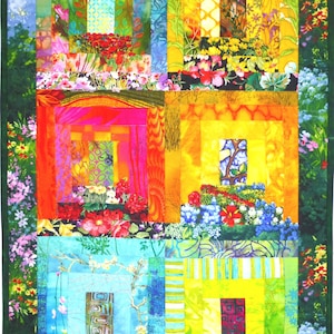 May include: A colorful quilt with a log cabin pattern. The quilt is made of various fabrics with floral prints and different shades of green, yellow, orange, red, and blue. The quilt is framed with a dark green border.