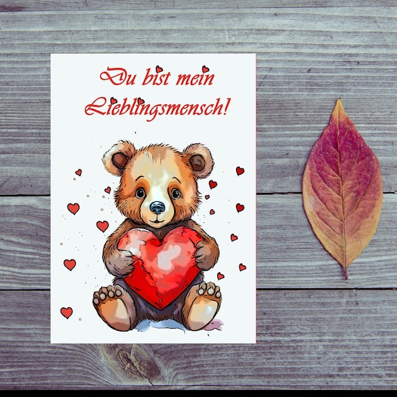 Postcard. Love bear with heart in hand.