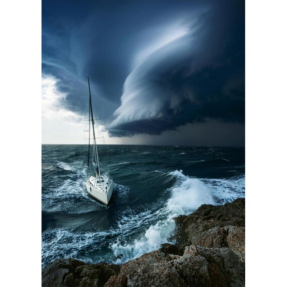 Postcard. Sailboat on the shore with approaching storm