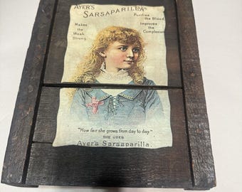 Quadro de madeira antigo com gravura publicitária da Ayer's Sarsaparilla, estilo vitoriano.