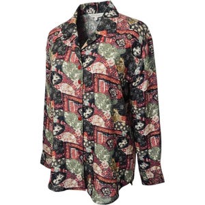 May include: A long-sleeve button-down shirt featuring a complex, multi-colored geometric and abstract pattern in shades of black, sage green, cream, and deep red. The shirt has a classic collar, a front button placket, and cuffed sleeves.