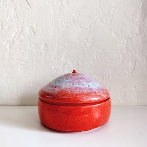 Orange and purple speckled 5" studio pottery container jar with pointy lid