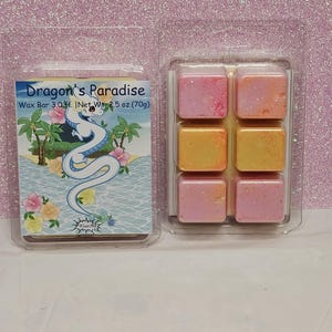 May include: A six-pack of wax melts in a clear plastic clamshell container. The wax melts are in a variety of colors, including pink, orange, and yellow. The container has a label that reads "Dragon's Paradise Wax Bar 3.0 ft. | Net Wt. 2.5 oz. (70g)"