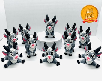 May include: A group of ten gray and white goat figurines with pink accents. The goats are in various poses, some standing and some sitting. The goats are all smiling and have large eyes.