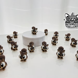 May include: A collection of small, brown squirrel figurines with large, expressive eyes and fluffy tails. The figurines are scattered on a white surface, some arranged around a small, white platform. The image includes a logo that says "3DGOB AUTHORIZED SELLER."