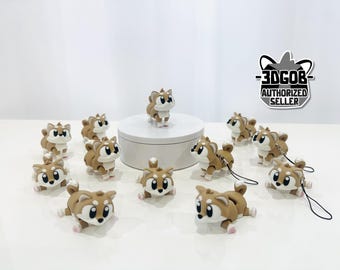 May include: A collection of Shiba Inu figurines in various poses, with brown and white coloring and black eyes. One figurine stands on a white platform, while others are scattered around. The image includes a "3DGOB AUTHORIZED SELLER" logo.