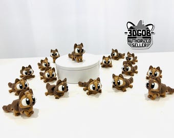 May include: A collection of small, brown and tan cartoon-style animal figurines with large, expressive eyes. One figurine stands on a white platform, while others are scattered around. The figurines have a stylized design, and the image includes a logo that says "-3DGOB- AUTHORIZED SELLER."