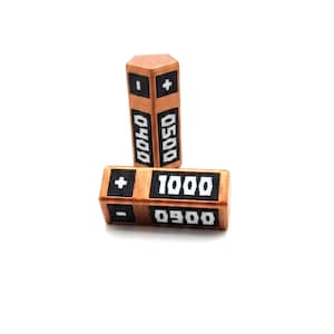 May include: Two copper-colored hexagonal gaming counters with black rectangular inlays. The vertical counter displays plus and minus signs with the numbers 0400 and 0500. The horizontal counter shows plus and minus signs with the numbers 1000 and 0900.