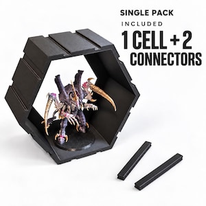 May include: A black hexagonal display cell with two separate black rectangular connectors. Inside the cell stands a painted miniature creature with purple, tan, and pink details. Text reads: SINGLE PACK INCLUDED 1 CELL + 2 CONNECTORS.
