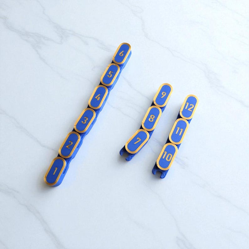 Segmented modular wargaming chain ruler in custom colors.